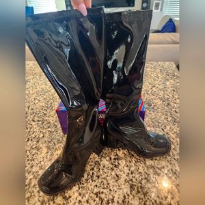 Knee high black patent leather boots